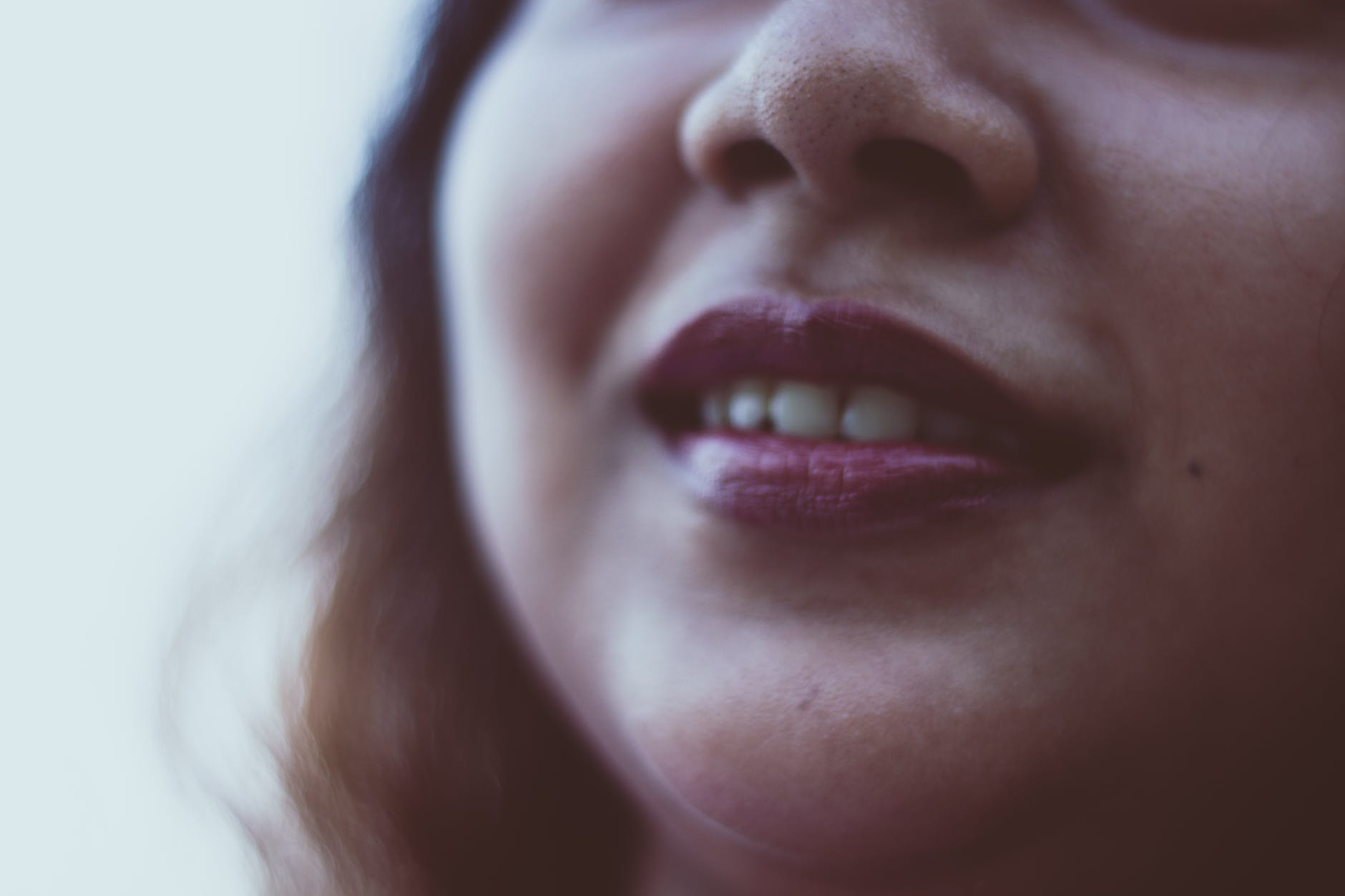 crop woman with bright lipstick